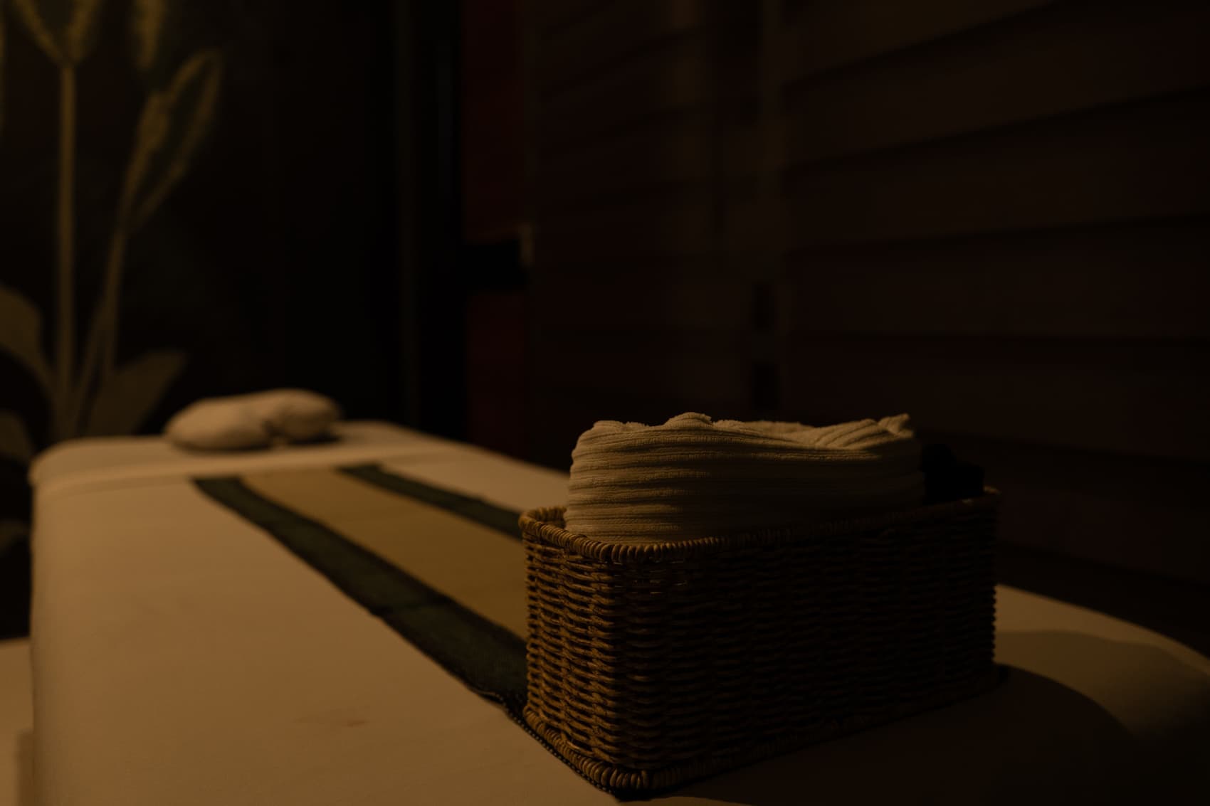 Calm Cradle spa ambience with towels and warm light
